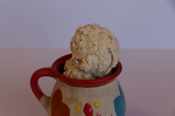 Creamy nuez (pecan) ice cream with nut pieces in a colorful jar from Las Michoacanas Paleteria in Rancho Cordova, CA