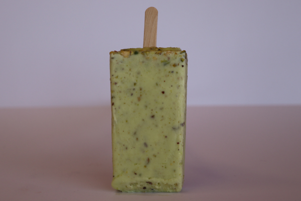 Pistachio paleta de leche with real nuts – a creamy and flavorful Mexican frozen dessert